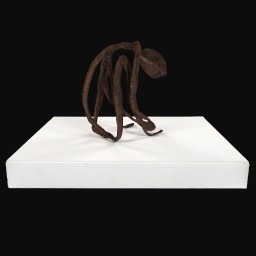 Iron painted wire and papier-mâché sculpture on white plinth of man sat down and curled over