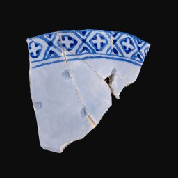 broken piece of porcelain cup with blue and white classical detail