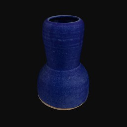 dark blue textured ceramic sculpture with rounded opening