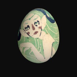 green painted egg depicting a womans face