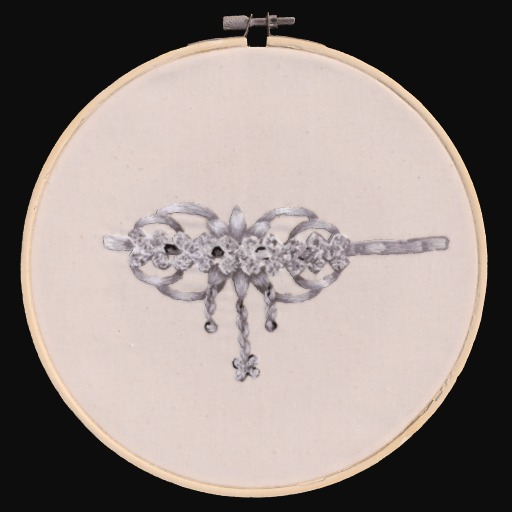 Embroidered jewelry on a cream fabric circle