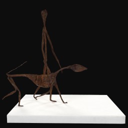 Iron painted wire and papier-mâché sculpture on white plinth of man walking with dog