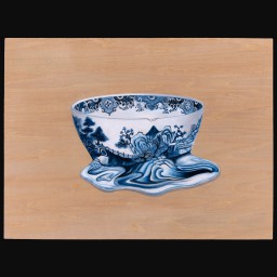 Image of Blue and white china tea cup melting out of its design