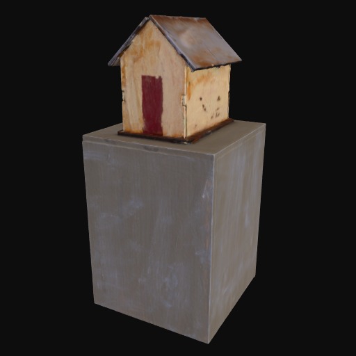 small model house with red door on grey plinth.