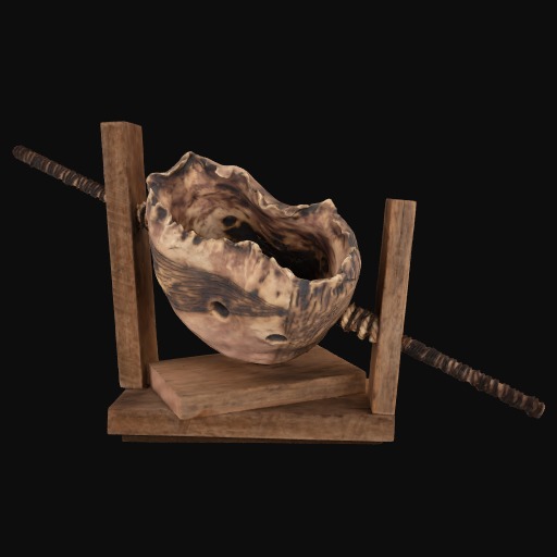 rock with metal through the centre of it in a wooden holder