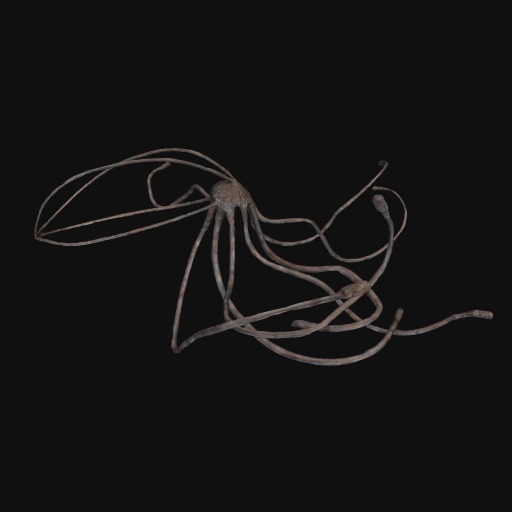 abstract metal sea-creature sculpture, black background.