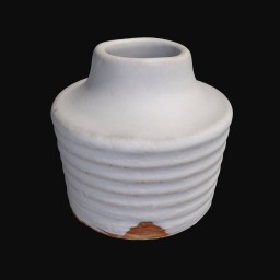 white textured ceramic sculpture with coil detail around the bottom and a round opening at the top
