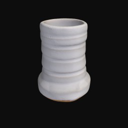 textured white ceramic sculpture with round opening