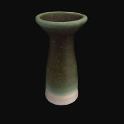 long green textured ceramic sculpture with larger round opening at the top and white base
