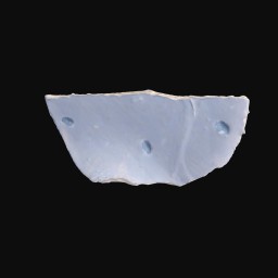 broken piece of porcelain cup cracked in the centre with blue and white classical detail