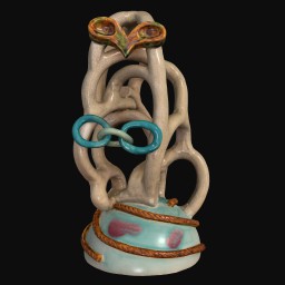 Face-like sculpture with a light blue base and small yellow eyes 