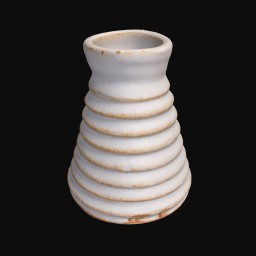 white textured ceramic sculpture with coil detail and round opening at the top